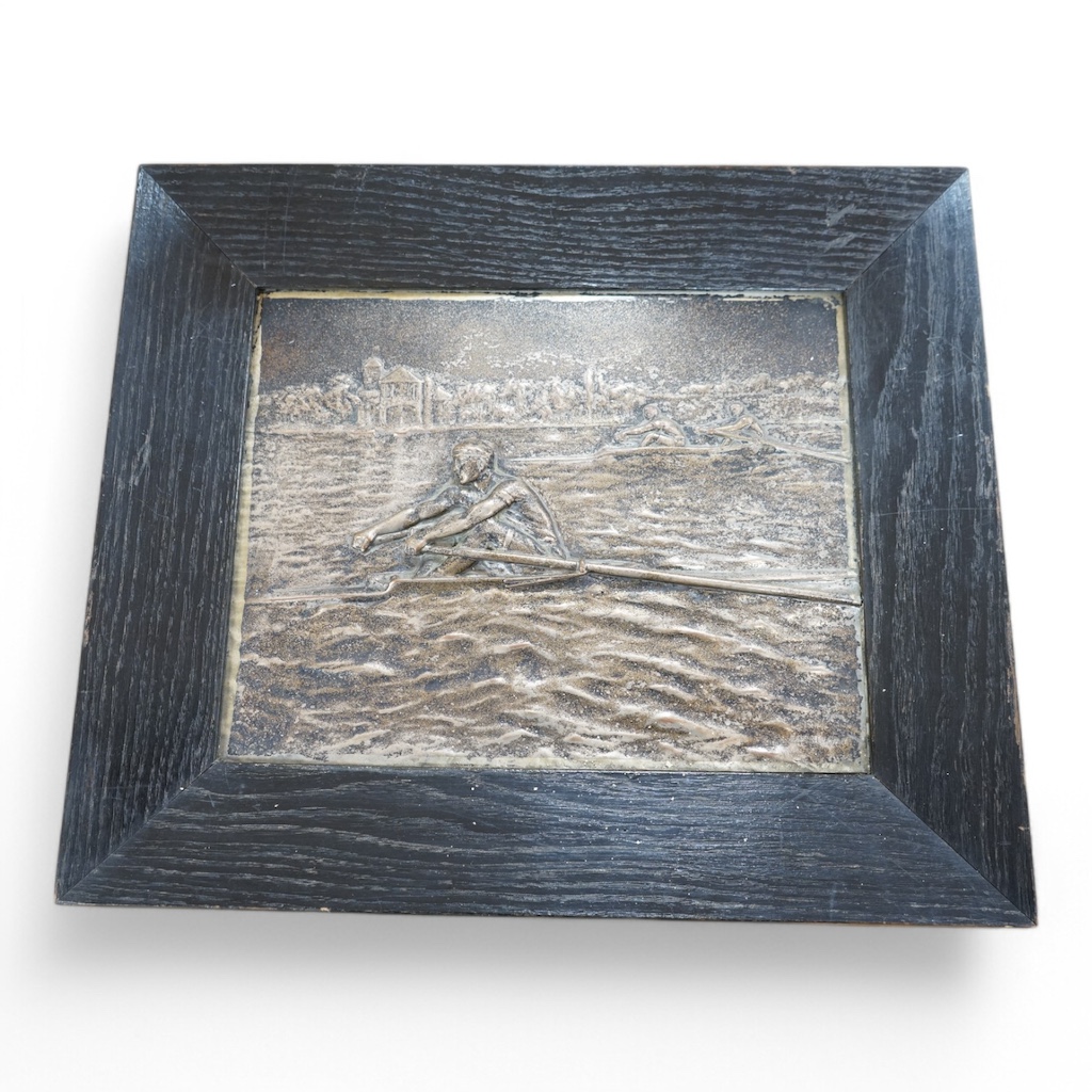 A 20th century Russian metal plaque of rowers, signed Korschann, oak framed, 30cm wide x 23.5cm high. Condition - good